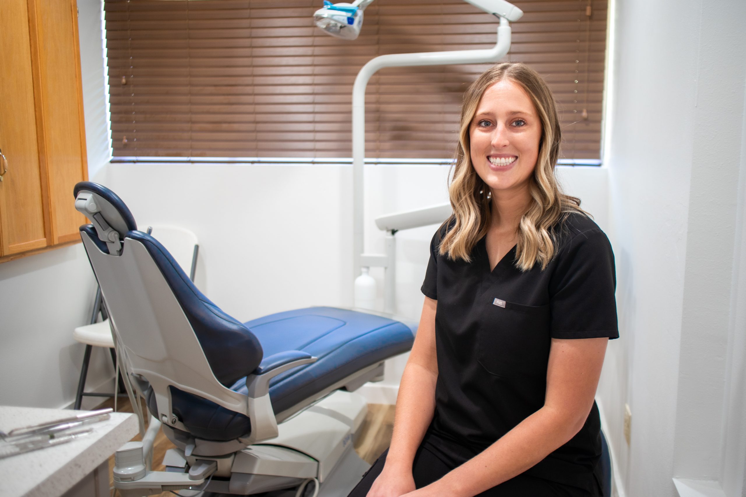 Taylor_Dental_1 Smiling woman dentist in a clean and inviting dental office